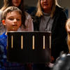 Visitors getting hands-on during a collections tour, exploring how a zoetrope produces the illusion of moving images. Photo credit: Nathan Buckley. 
